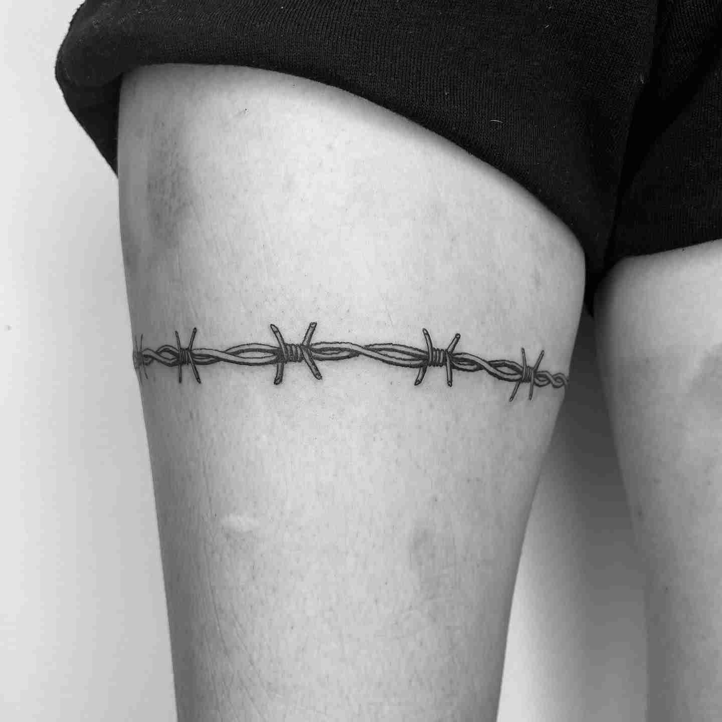 Barbed wire arm band tattoo